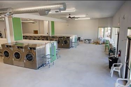Wide interior view of the laundromat